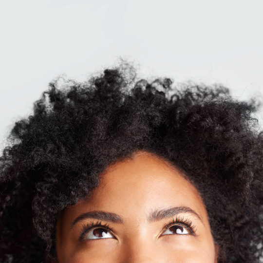 Woman's head with her eyes looking up